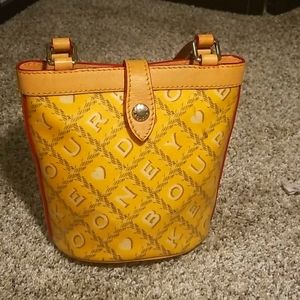Yellow Dooney and Bourke bucket bag
